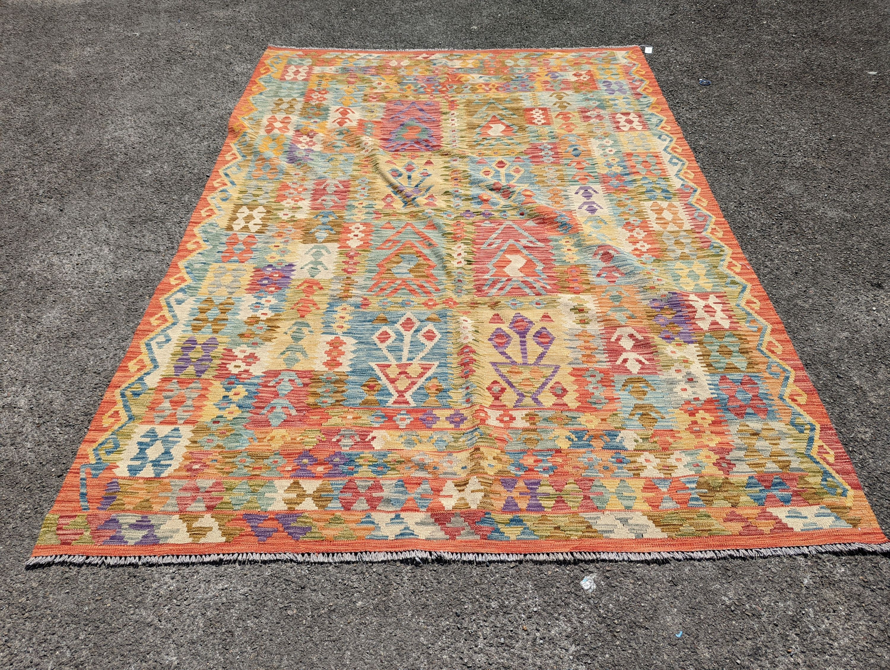 An Anatolian polychrome geometric flatweave Kilim carpet, 290 x 210cm